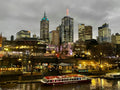 Yarra River cruise boat at Southbank, Melbourne | vibrant waterfront dining and city skyline at dusk, Victoria, Australia