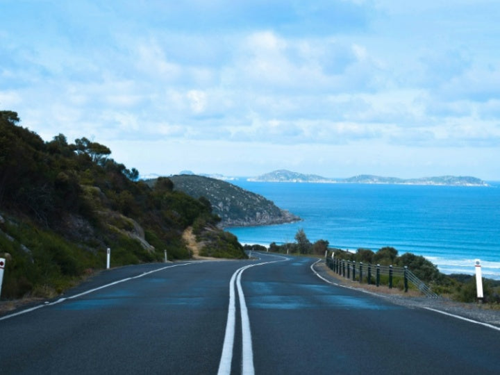 Winding coastal road at Wilsons Promontory National Park on an overcast day | moody ocean views and scenic drive in Australia