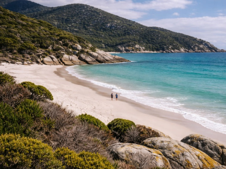 Couple walking on white sand at Squeaky Beach, Wilsons Promontory | crystal clear turquoise water and granite coastline in Australia